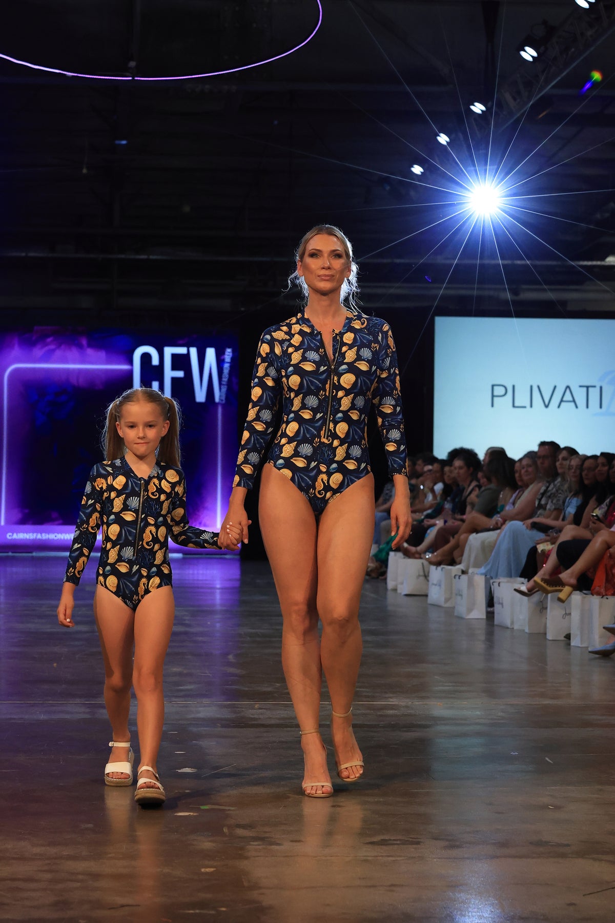 Model wears the LANA Čiovo long sleeve swimsuit on the runway