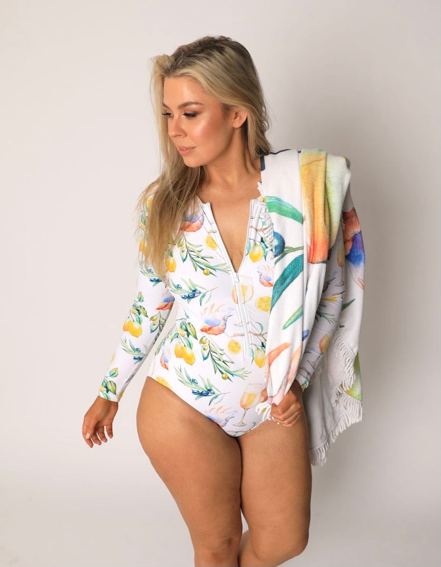 One piece long sleeve swimsuit with open back, front zip and neck tie in the Plivati Adriatic print.
