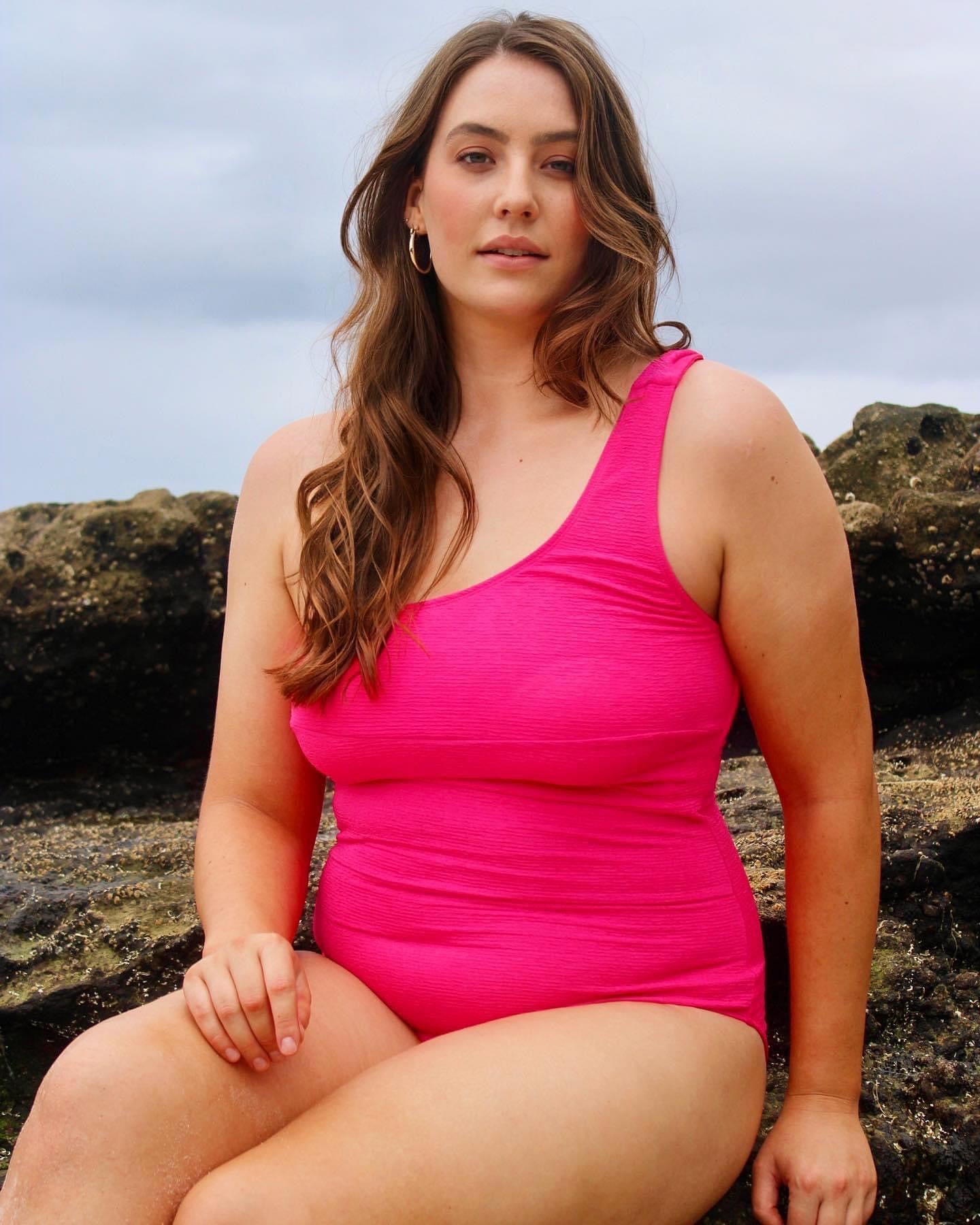 Hot pink one shoulder textured one piece swimsuit designed in Australia by Plivati Swimwear.
