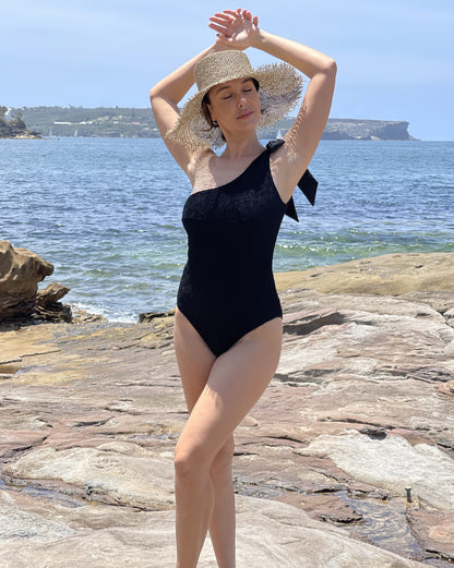 Black one shoulder textured one piece swimsuit designed in Australia by Plivati Swimwear.